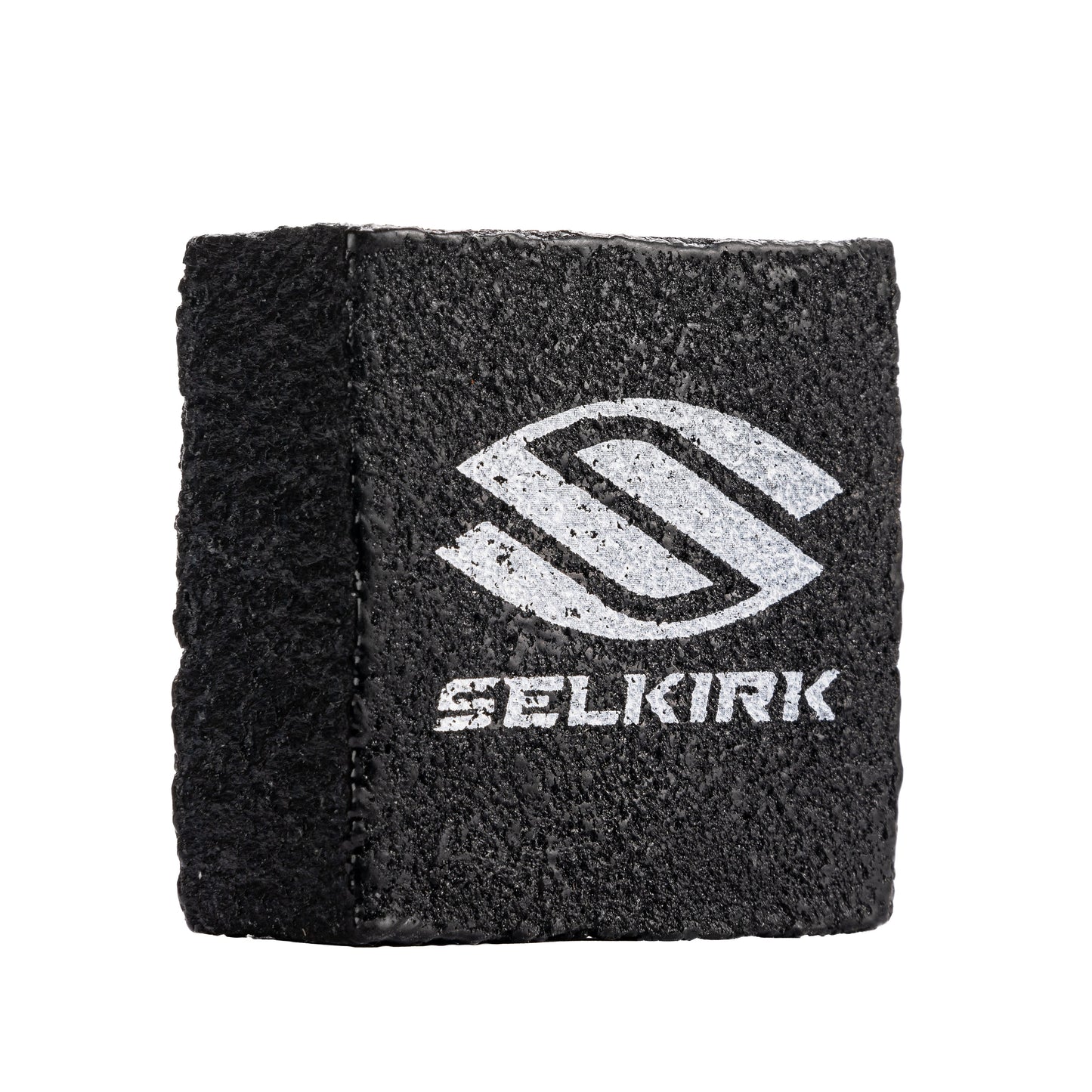 A black block with the word Selkirk Carbon Fiber Pickleball Cleaning Block on it.