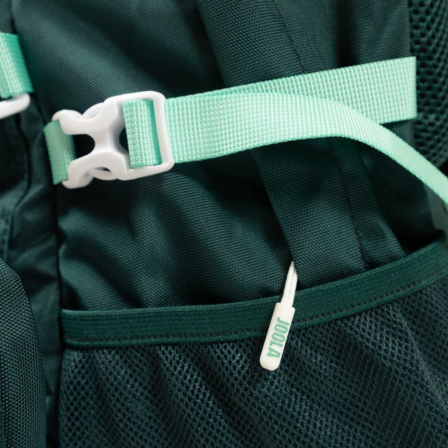 Close-up of a green JOOLA Utility Backpack with mint green straps and buckle, featuring a "100L" item in the mesh side pocket—ideal for use as a pickleball backpack.