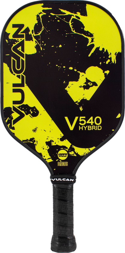 A Pickleballist Vulcan V540 Hybrid pickleball paddle with a bold yellow splatter and black design featuring abstract faces.