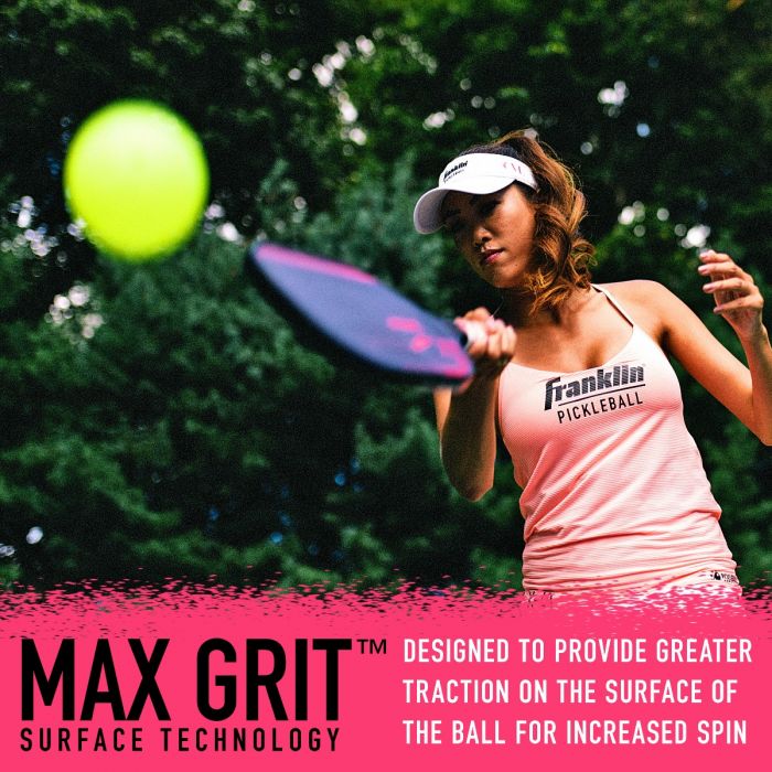 Woman playing pickleball, swinging Franklin Christine McGrath Signature Pickleball Paddle at a yellow ball, with text promoting Pickleballist's max grit surface technology for increased spin.