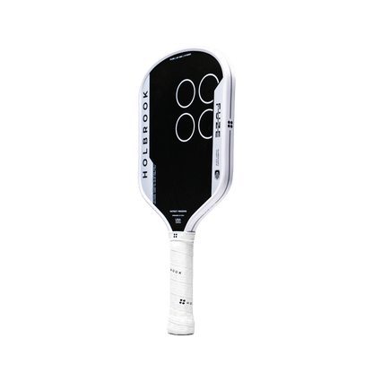 The Holbrook Fuze Hybrid 16mm Pickleball Paddle by Holbrook features a black and white Carbon-Aramid-Carbon face with four white circles on the front and a white grip, displayed against a plain light background.