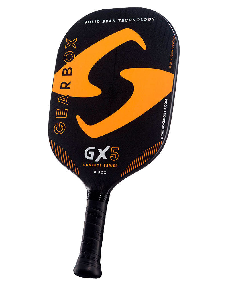 A Pickleballist GX5 pickleball paddle, featuring a black and orange design with "solid span technology" text.