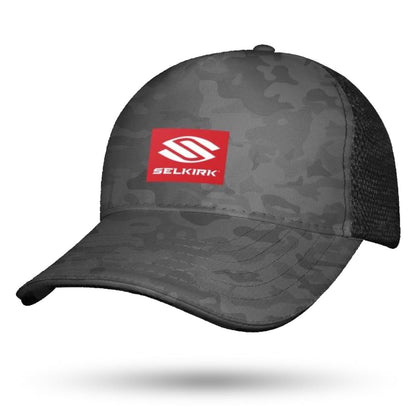 A grey camo Selkirk Red Label Camo Sport Trucker Pickleball Hat with a black mesh back and a red rectangular patch on the front featuring the Selkirk logo.