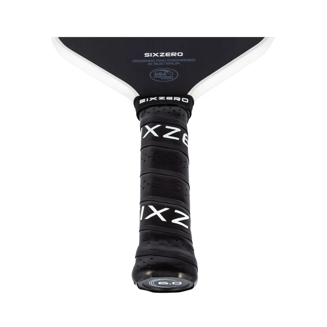 A black and white Six Zero paddle with the word xx written on it.