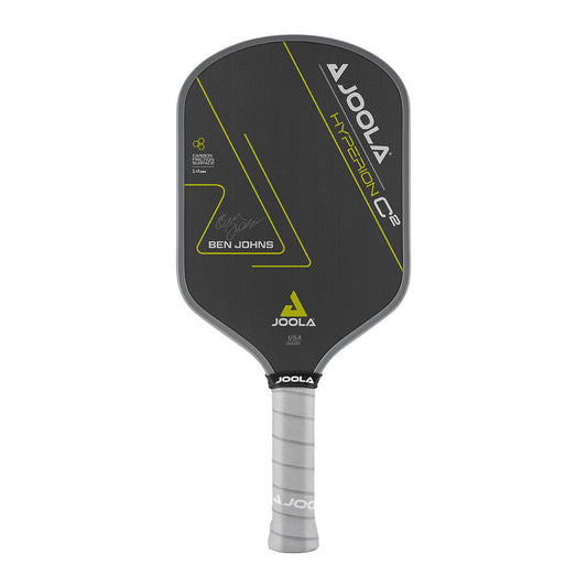 A JOOLA Ben Johns Hyperion C2 CFS 14 Pickleball Paddle with a black face, yellow accents, and a gray handle. The paddle features a signature and logo, along with text indicating model details.