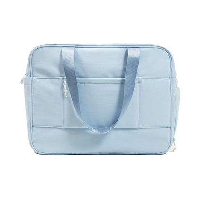 The JOOLA Overnighter Puff Bag by JOOLA is a light blue rectangular tote with two handles, front pockets, and a zipper closure, featuring durable construction. Shown against a plain white background.