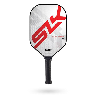 A Selkirk SLK Evo Soft XL Pickleball Paddle with a red and white design, featuring the Selkirk logo in large red letters and a black handle. This paddle boasts a durable edge guard and a high-performance polymer core for enhanced play.