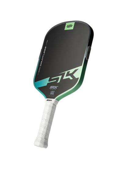 The Selkirk SLK Dauntless Elongated 16mm Pickleball Paddle features a black and green design, bold “Dauntless” branding on the face, and a white perforated grip.