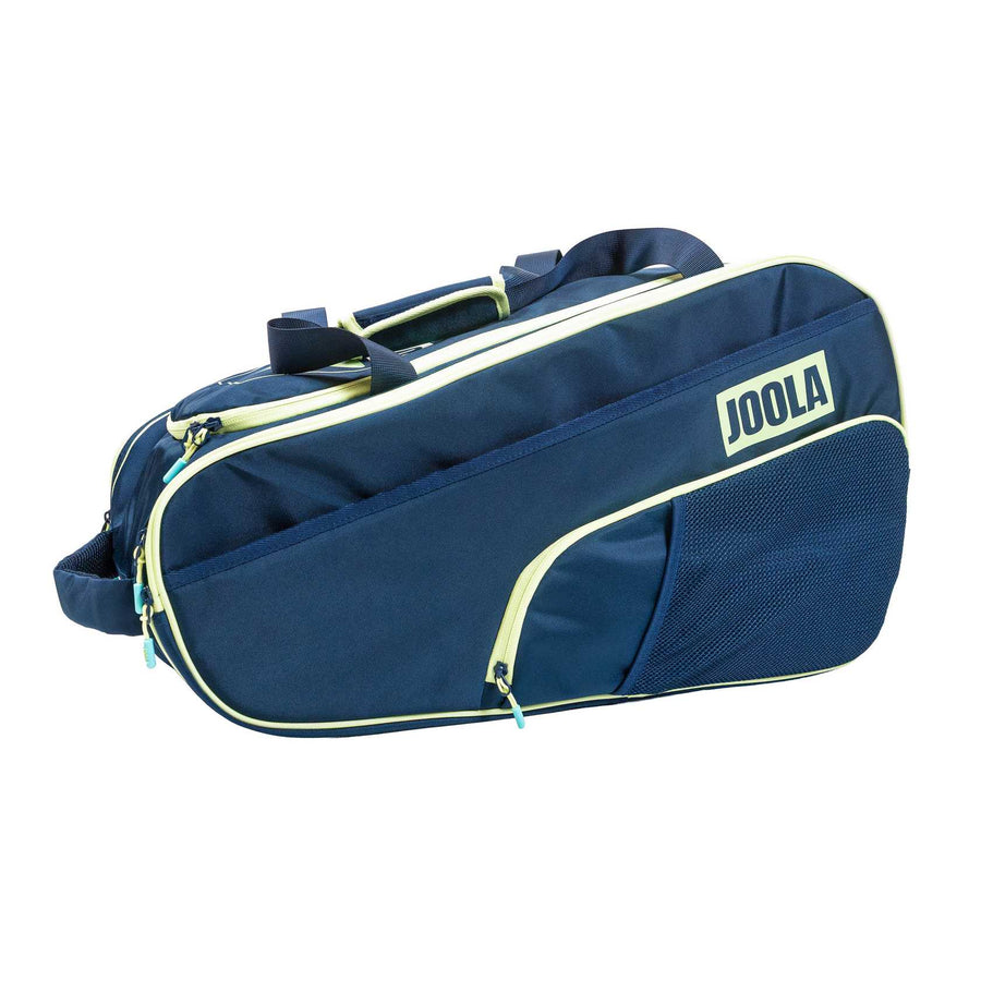 The Pickleballist 2026 Tour Elite Pro Pickleball Bag features navy blue with light yellow accents, a side mesh pocket, and carrying handles—ideal for tournament players to carry their court gear.