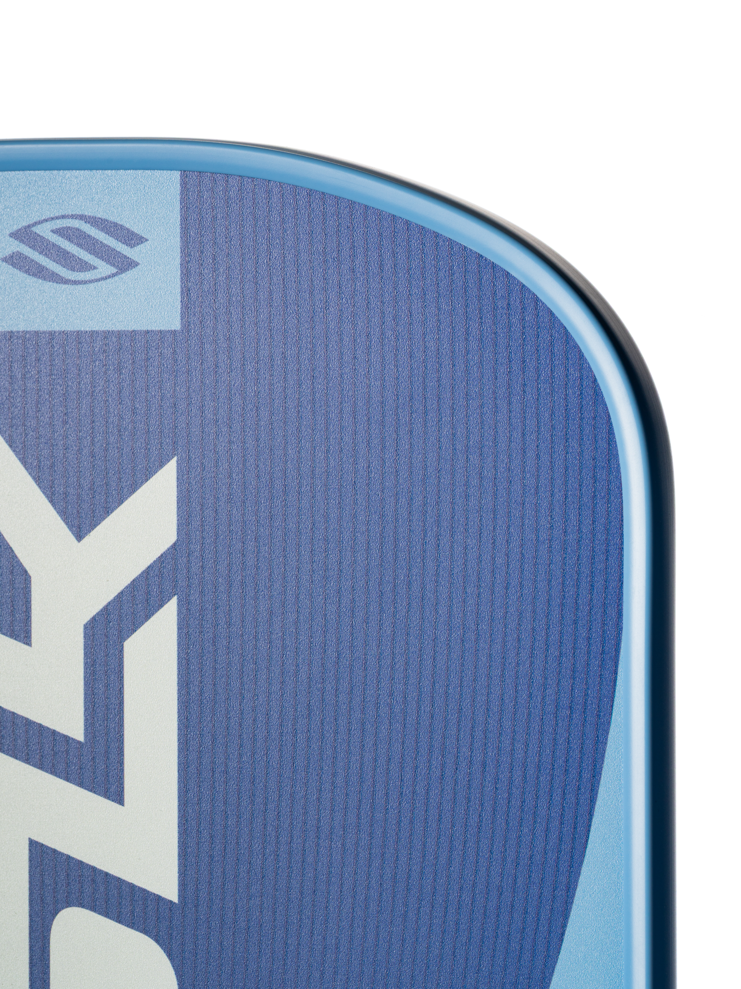 Close-up of the top corner of the Selkirk SLK Valkyrie Widebody 16mm Pickleball Paddle featuring a blue surface, smooth curved edge, and white geometric patterns.