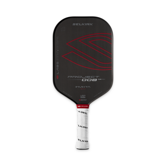 A black Pickleballist Selkirk Labs Project 008 Invikta Elongated 16mm pickleball paddle with red accents and a white grip wrapped in Selkirk-branded tape.