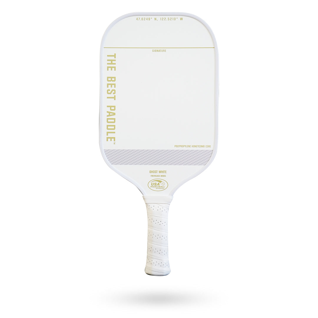 A white (The Best Paddle Fiberglass Pickleball Paddle) with the word 'the best player' on it.