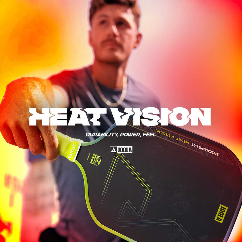 A man holds a JOOLA Heat Vision Perseus 16mm Pickleball Paddle toward the camera, with "HEAT VISION" and "Durability, Power, Feel" boldly overlaid to highlight its advanced core.