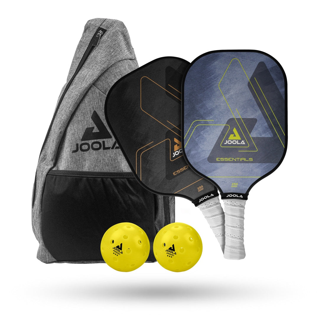 Image of the JOOLA Essentials Paddles, Balls, and Bag Set including two paddles with a multi-layer fiberglass design, two yellow balls, and a gray JOOLA-branded carry bag with a front pocket.