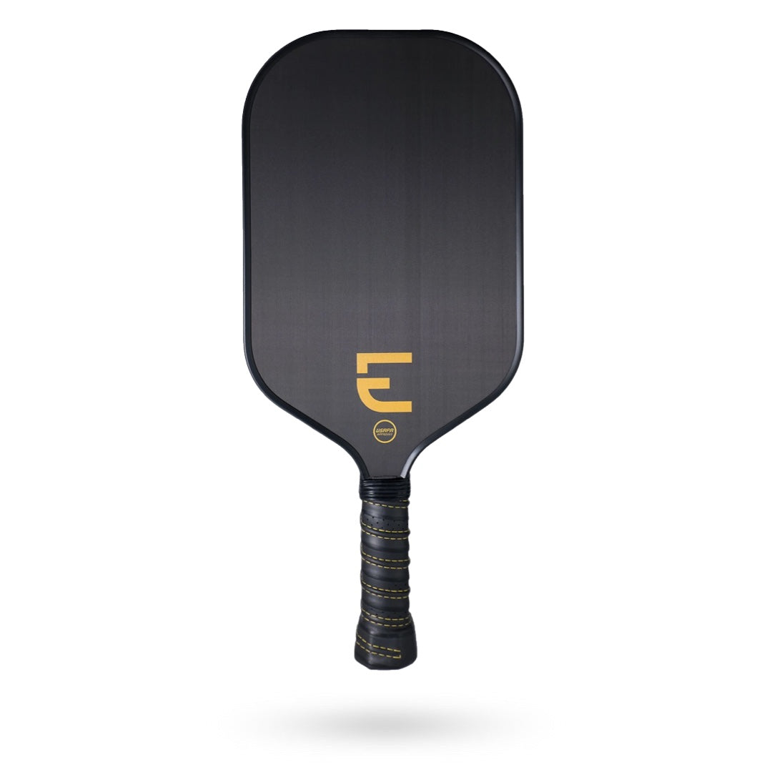 The Electrum E Pickleball Paddle features a rectangular face with rounded corners, a yellow logo near the handle, and the ultimate spin and control provided by its carbon fiber construction. The handle is wrapped in black with stylish yellow accents.