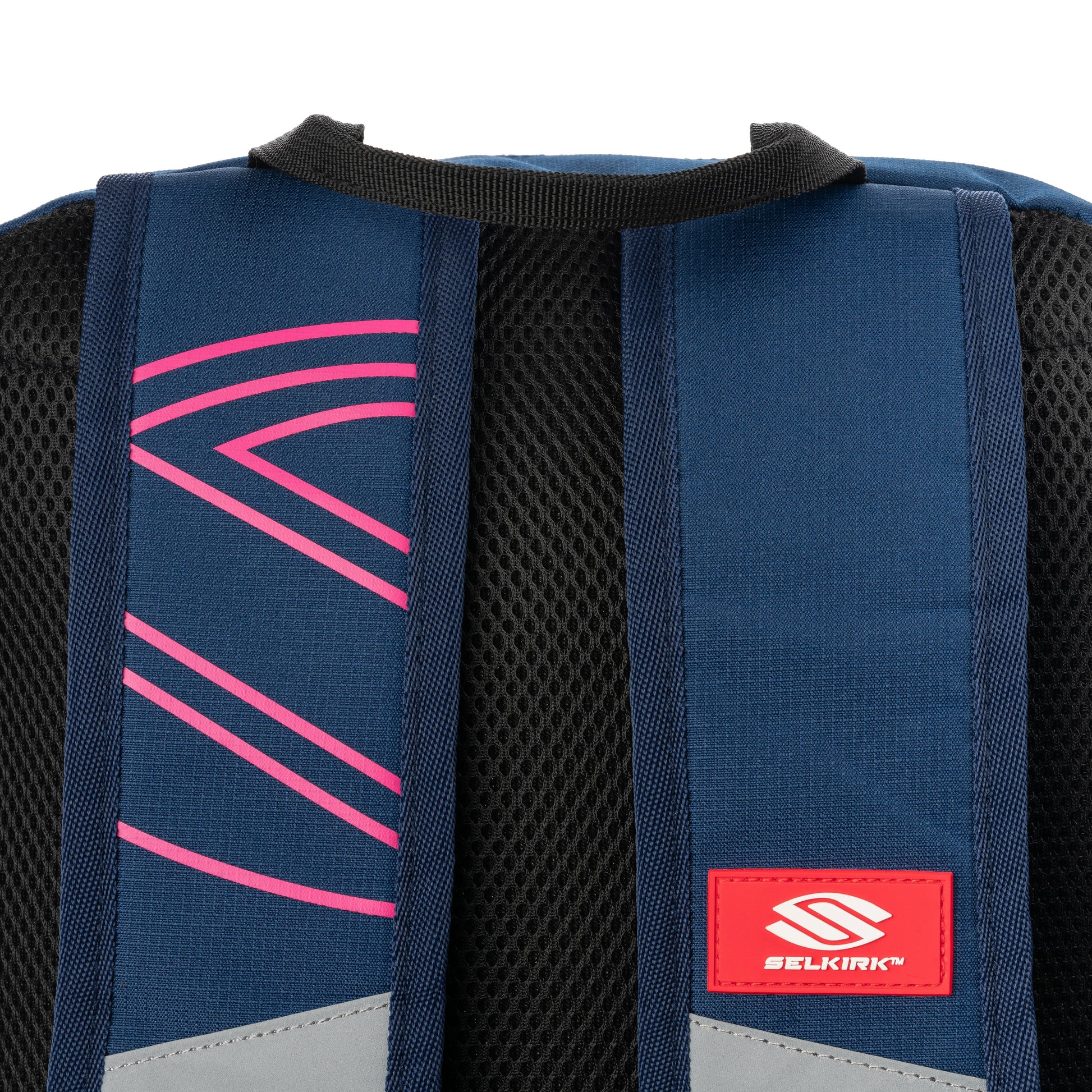 The back of a Selkirk Core Series Day Backpack Pickleball Bag with a pink and blue logo.