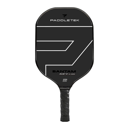 A black Paddletek Bantam ALW-C 14.3mm Carbon Fiber Pickleball Paddle with a textured grip and minimalist white design on the face. The paddle features branding and the words "Made in USA" near the handle.