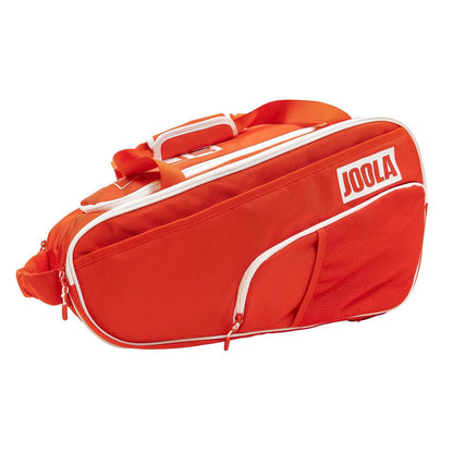 The Pickleballist 2026 Tour Elite Pickleball Bag is a rectangular, bright orange bag with white zippers, a side pocket, and a carrying handle—ideal for sports enthusiasts to carry their paddles.