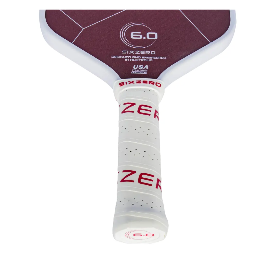 A Six Zero Ruby Kevlar (16mm) Pickleball Paddle with a red and white design.