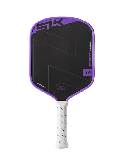 The Selkirk SLK ERA Power Widebody Carbon Fiber Pickleball Paddle features a black and purple geometric design, raw spin technology, a white perforated grip, and prominent Selkirk branding.
