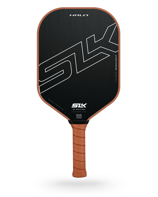 A black and gray Selkirk SLK Halo Max pickleball paddle with a white Pickleballist logo and a brown perforated handle grip; Choose Color, isolated on a white background.