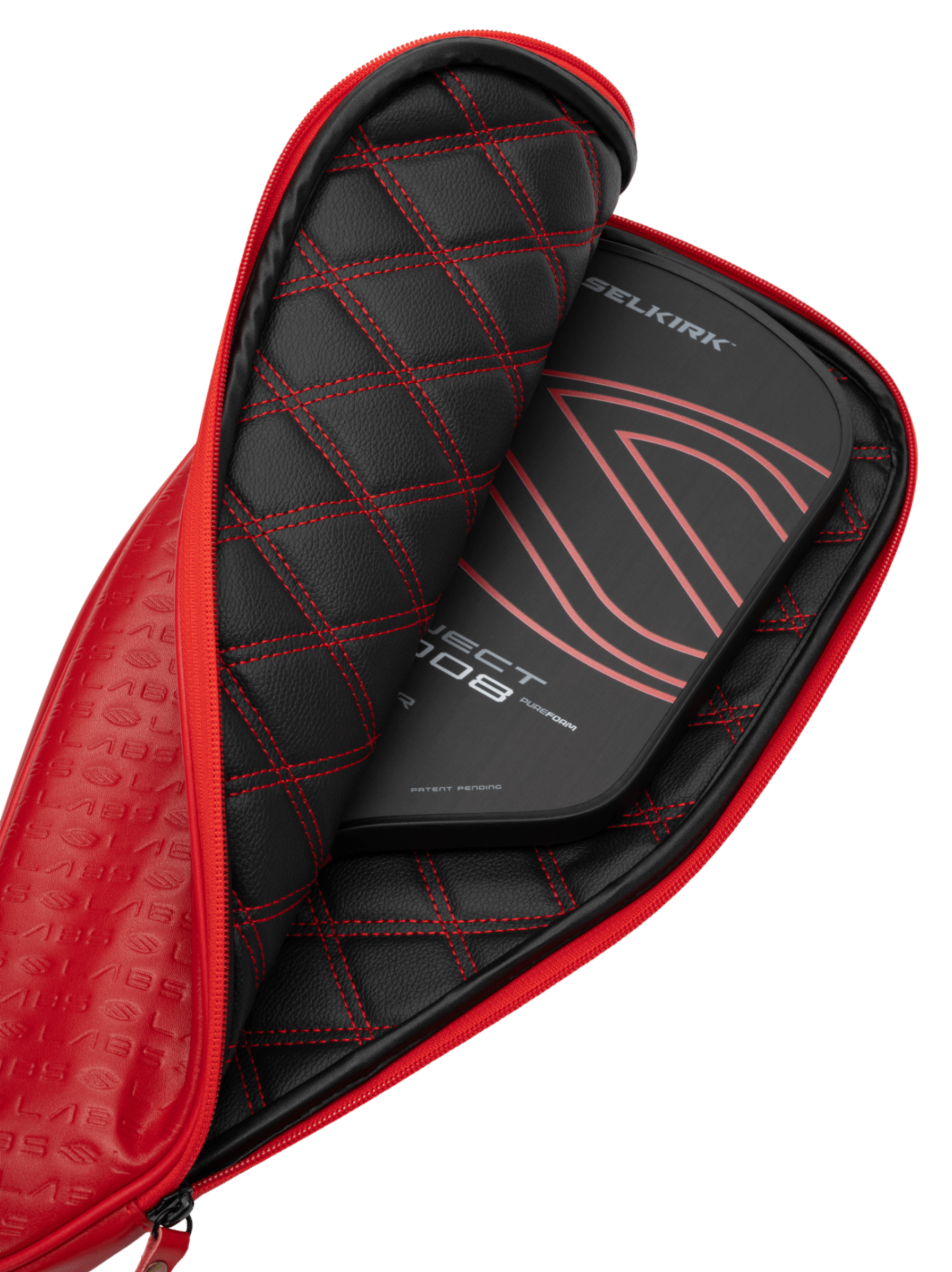 The Selkirk Labs Project 008 Invikta Elongated 13mm Pickleball Paddle, featuring a sleek black design with red accents, is partially visible inside its matching black and red quilted case.