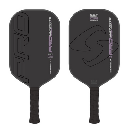 Two black pickleball paddles, the "Gearbox Pro Ultimate Power Elongated" and "SST CORE," feature textured handles and geometric designs.