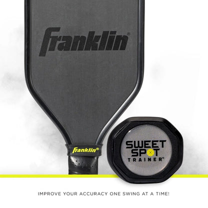 A Franklin Sweet Spot Training Pickleball Paddle made with T700 carbon fiber sits next to a Sweet Spot Trainer. Text below reads, "IMPROVE YOUR ACCURACY ONE SWING AT A TIME!