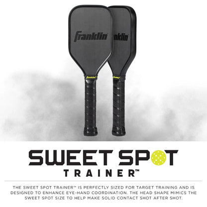 Two Franklin Sweet Spot Training Pickleball Paddles by Franklin, crafted with T700 carbon fiber to enhance eye-hand coordination by simulating the sweet spot size, placed against a white background.