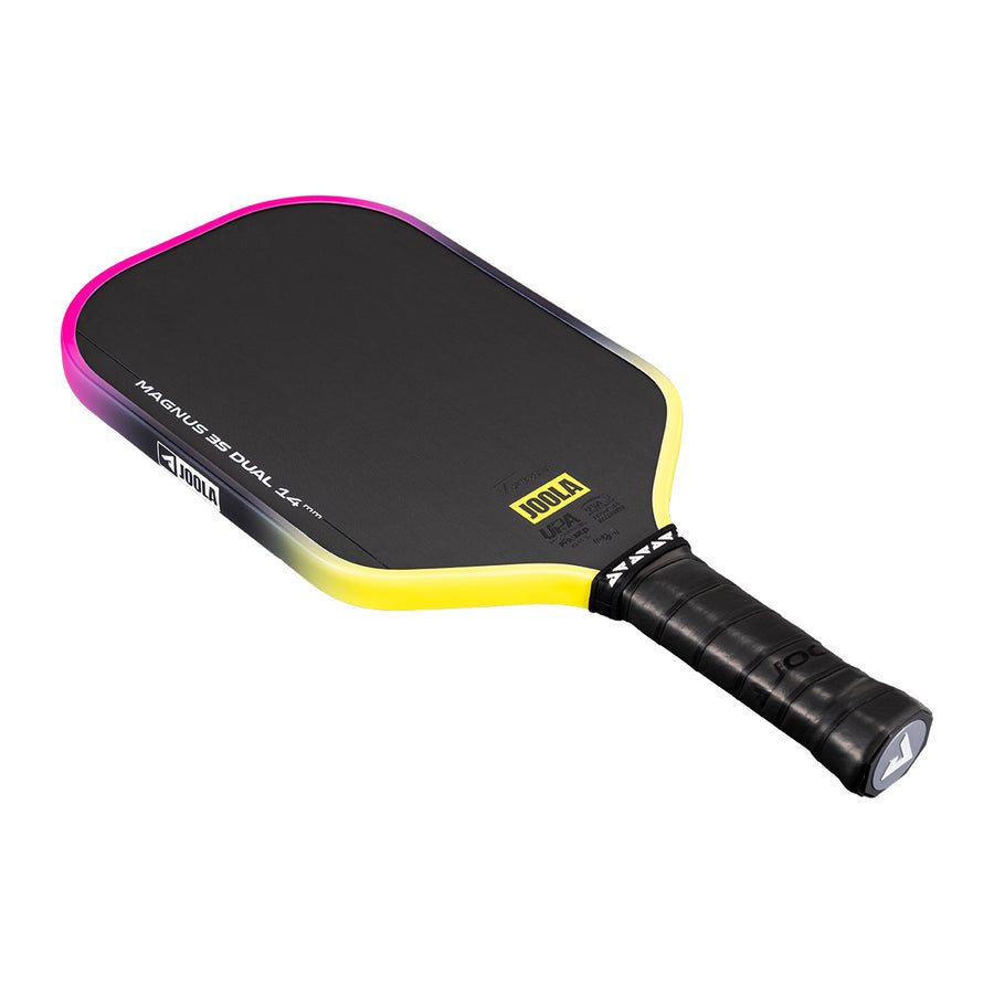 The JOOLA Magnus 3S Dual 14mm Pickleball Paddle features a black face, yellow edge, black grip handle, and a Charged Carbon Surface for enhanced power and control.