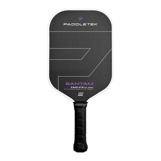 A close-up image of a Paddletek Bantam TKO-CX 14.3mm Carbon Fiber Pickleball Paddle with a black and white design and purple accents.