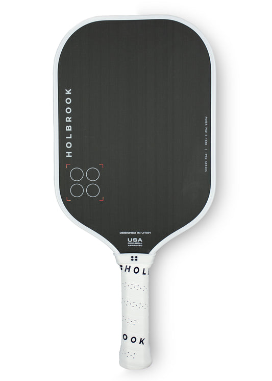 A black and white Holbrook Power Pro E 16mm ping pong paddle on a white background.
