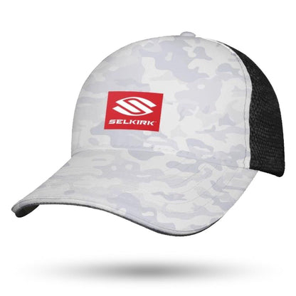 A grey and white Selkirk Red Label Camo Sport Trucker Pickleball Hat with a black mesh back. The front of this performance trucker hat has a red rectangular logo with the text "Selkirk" in white, featuring Stretch-Wik technology for added comfort.