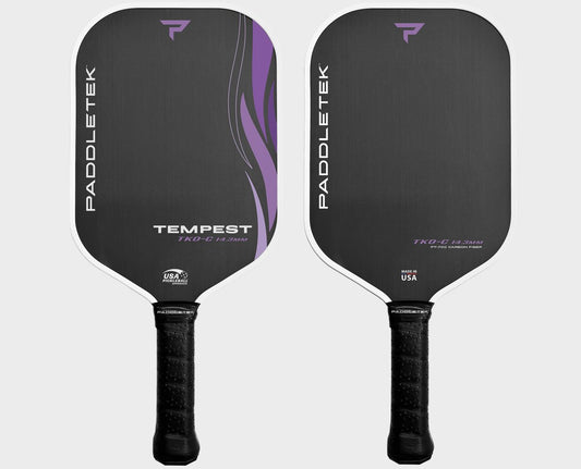 Two Paddletek Tempest TKO-C 14.3mm Carbon Fiber Pickleball Paddles with black faces, purple accents, and textured grips. The paddle on the left reads "Tempest," and both display the USA Pickleball Association logo.