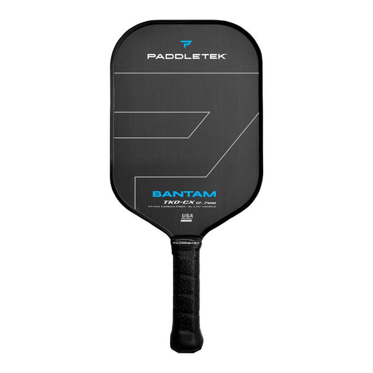 A Paddletek Bantam TKO-CX 12.7mm Carbon Fiber pickleball paddle featuring a black face, white text, and a black grip.