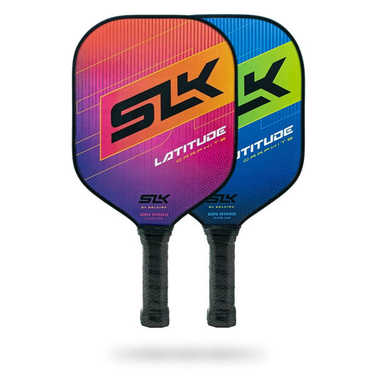 Two colorful Pickleballist Selkirk SLK Latitude pickleball paddles, one with a purple to red gradient and the other with a blue to green gradient, both featuring a grip circumference of 4.25 inches, positioned