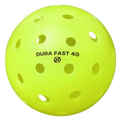 Bright yellow perforated plastic ball with the text "Onix Dura Fast 40 Pickleball Balls" printed on it.