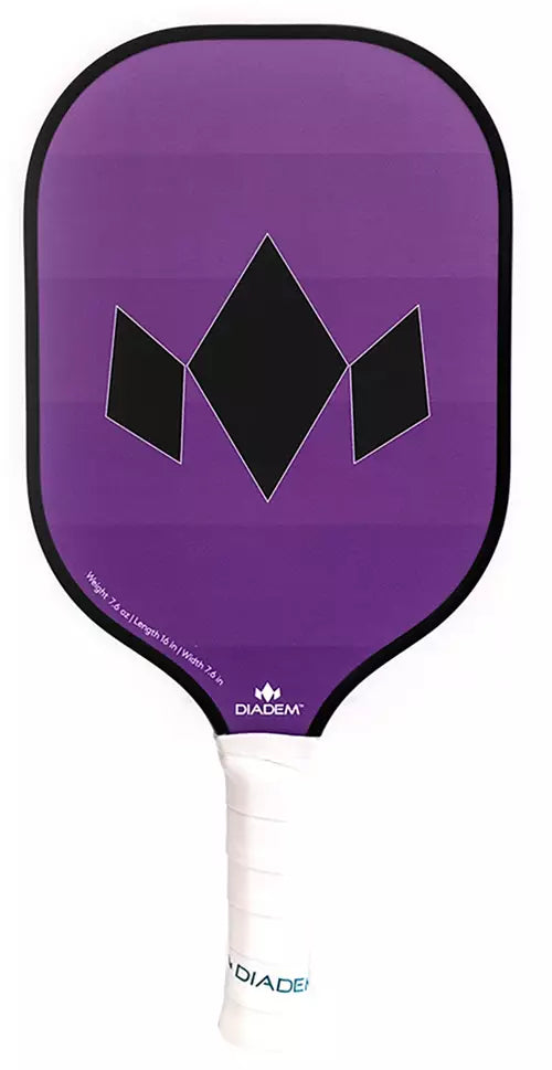 The Diadem Team Pickleball Paddle features a purple face with a black geometric design and a white grip handle, prominently displaying the "Diadem" brand at the base of the paddle face.