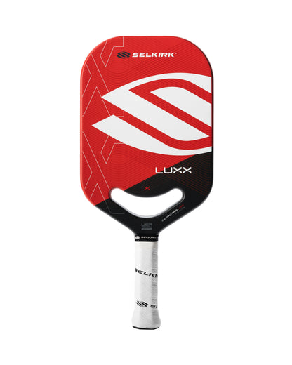 A Pickleballist Selkirk LUXX Control Air Invikta pickleball paddle with a red and black geometric design on the front and a white grip.