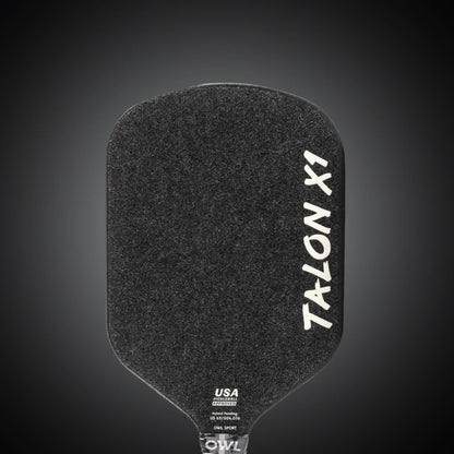 A black OWL Talon X1 Quiet Pickleball Paddle with a textured surface for superior spin control, "USA Pickleball Approved" near the handle, and featuring the advanced Acoustene Power System.