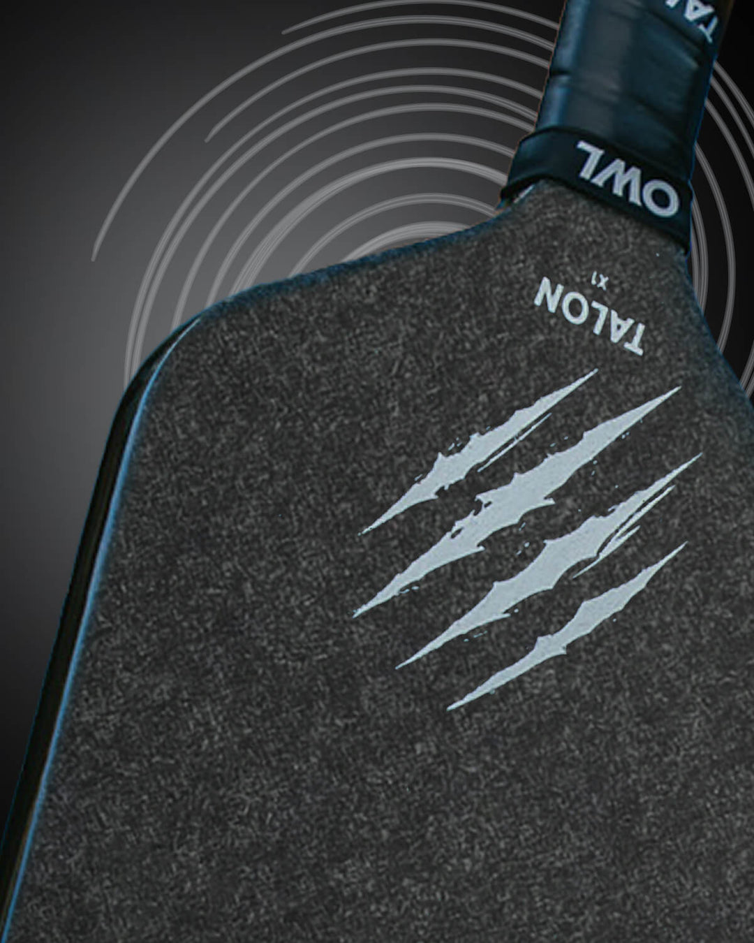 Close-up of the OWL Talon X1 Quiet Pickleball Paddle in black, featuring the Acoustene Power System, "TALON" and three claw marks on its face, with "OWL" branding on the handle.
