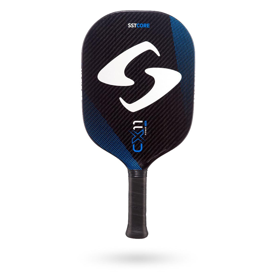 A black and blue Gearbox CX11 Quad Pickleball Paddle with the letters "SSTCORE" at the top, a large "S" symbol in the center, and "GX11" at the bottom. Featuring a SST ribbed core for enhanced performance.