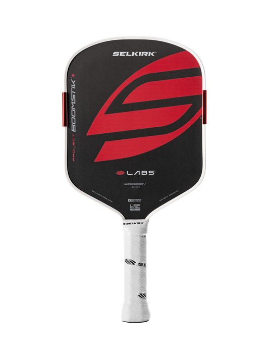The Selkirk LABS Project Boomstik Widebody 16mm Pickleball Paddle with Infinigrit features a black and red carbon face, white edge guard, white grip, and displays the Selkirk brand name and logo.
