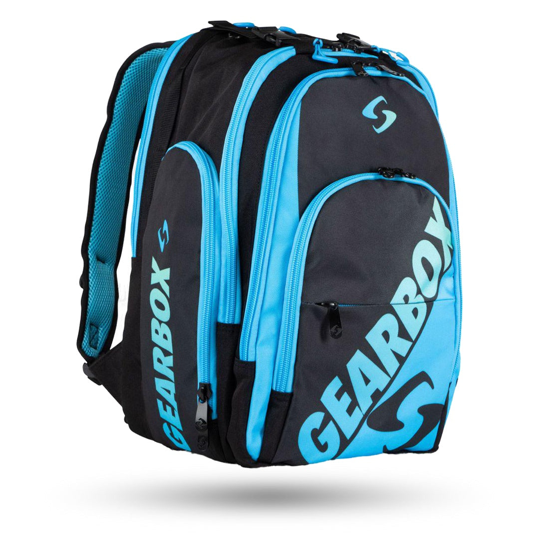 A durable and practical blue and black Gearbox Court Backpack Pickleball Bag featuring multiple spacious compartments, zippered pockets, and padded shoulder straps. The full-sized backpack proudly displays the Gearbox logo on the front.