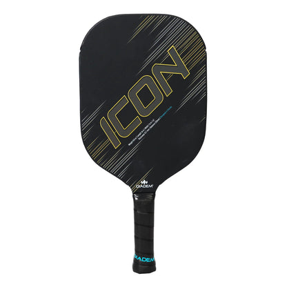 The Diadem Icon V2 Standard Pickleball Paddle by Diadem features a black face with diagonal gold and gray lines, a black handle wrapped with grip tape, and the word "ICON" boldly displayed on the front.