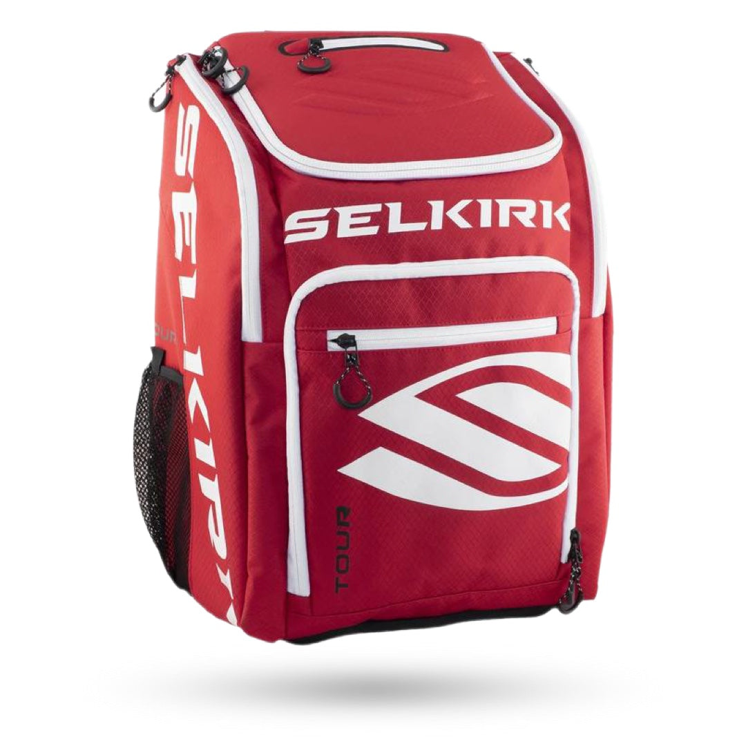 A red and white Selkirk Tour Backpack (2021) Pickleball Bag with the word selikr on it.
