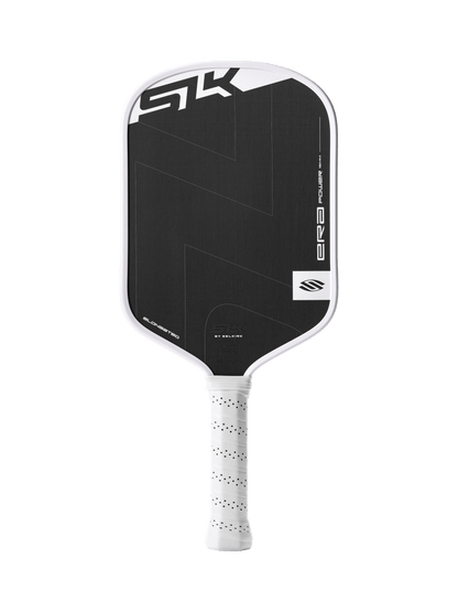 This product description features the Selkirk SLK ERA Power - Elongated, a black and white pickleball paddle with a textured surface, perforated white grip, and the Selkirk logo with “ERA” shown on the face.
