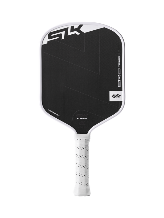 The Selkirk SLK ERA Power - Widebody by Selkirk is a black and white pickleball paddle with a textured surface, white grip, and bold geometric design.