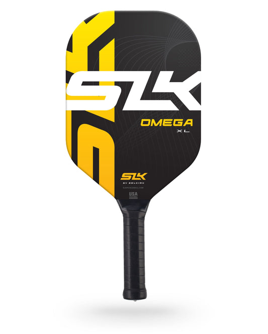 A Pickleballist SLK Omega XL pickleball paddle with a black, yellow, and white design, featuring the Pickleballist logo prominently.