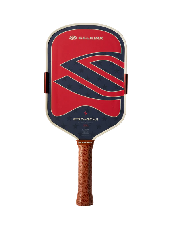 The Selkirk OMNI Elongated 16mm Pickleball Paddle features a red, blue, and black face with a large "S" logo and a brown textured grip.